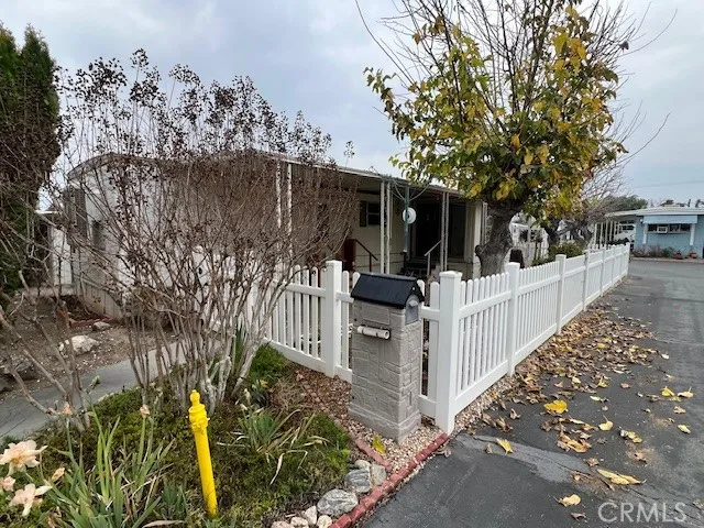 a view of a house with a fence