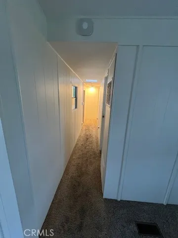 a kitchen with a stove a sink and a refrigerator