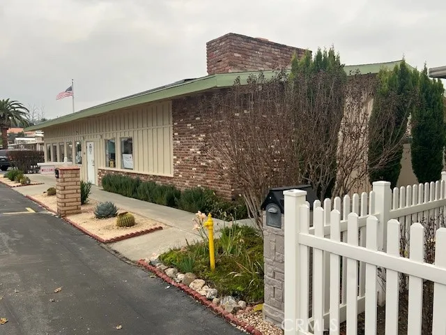 a living room with furniture and a piano
