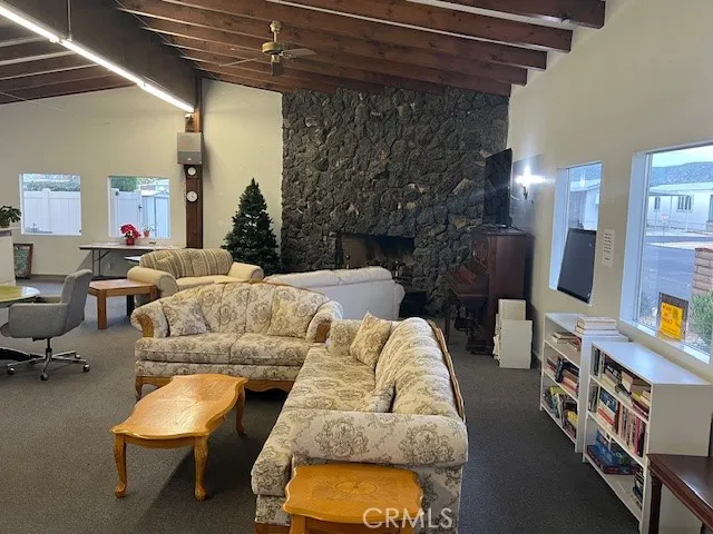 a living room with furniture a table and chairs