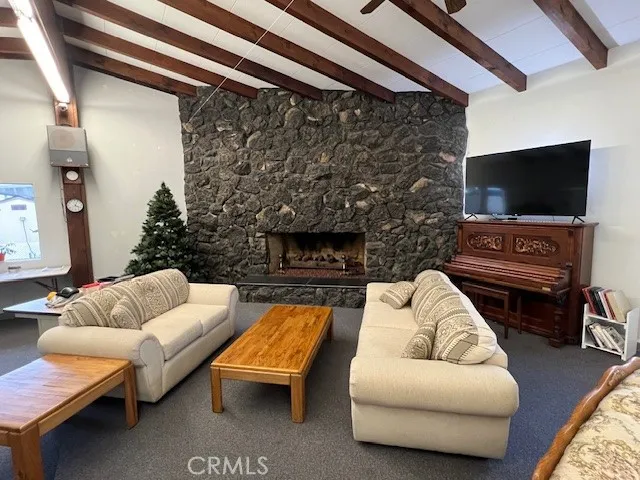 a room with gym equipment and a chandelier