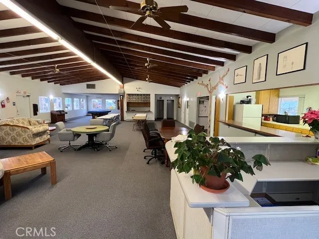 a room with wooden floors and white walls