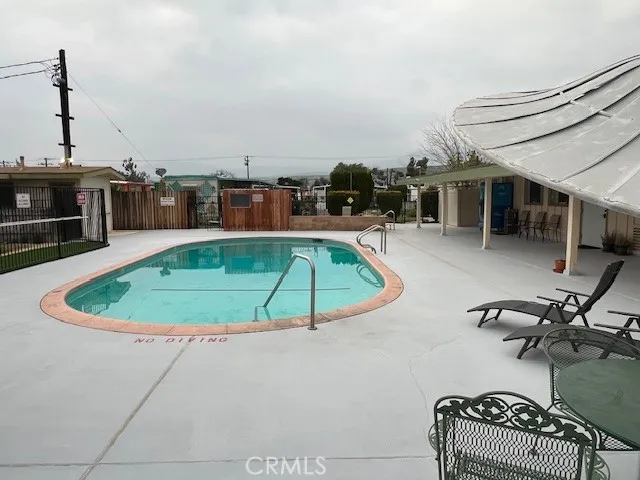 a view of a backyard with sitting area