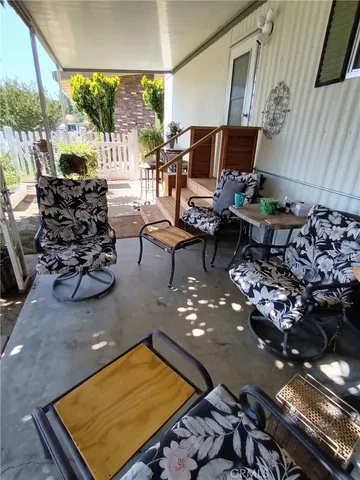 a room with lots of chairs and a chandelier