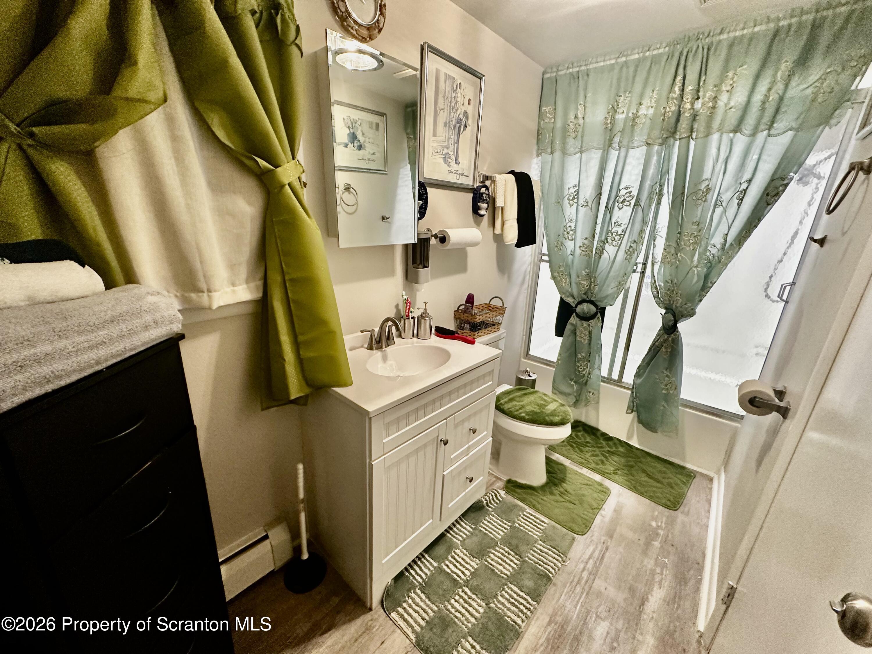 1727 Bulwer Street Scranton, PA 18504 - Photo 15 of 40 a bathroom with a sink a toilet and shower