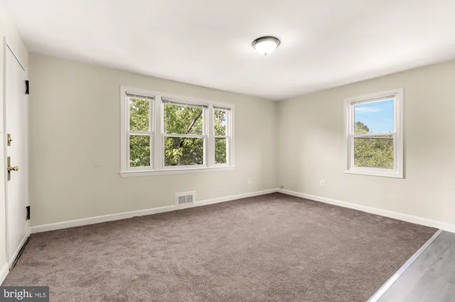 an empty room with windows