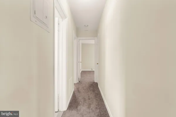 a bathroom with a sink mirror and toilet