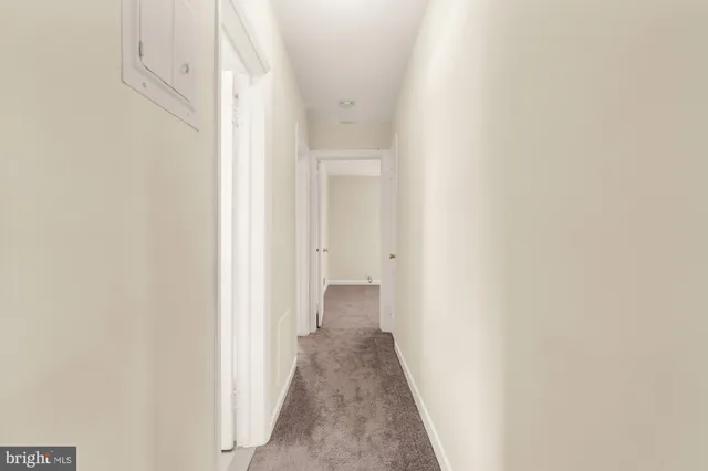 a bathroom with a sink mirror and toilet
