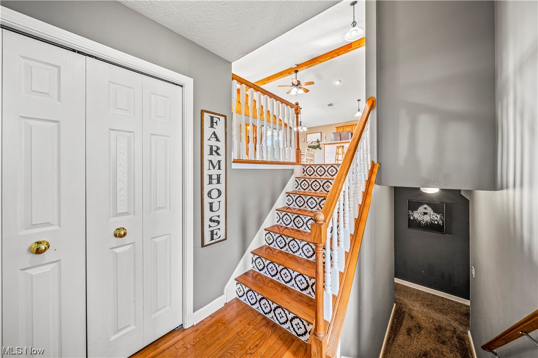 7290 Turner Road Pierpont, OH 44082 - Photo 2 of 36 Stairs featuring carpet and ceiling fan