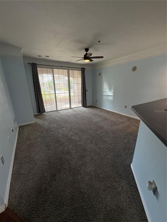 3280 Soho Street, Unit 104 Orlando, FL 32835 - Photo 11 of 23 a view of an empty room with a window