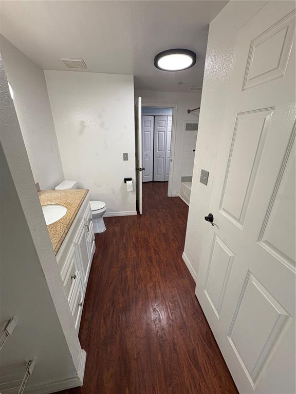 3280 Soho Street, Unit 104 Orlando, FL 32835 - Photo 13 of 23 a view of wooden floor and staircase