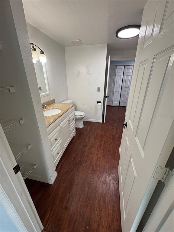 3280 Soho Street, Unit 104 Orlando, FL 32835 - Photo 14 of 23 a room with furniture and hardwood floor