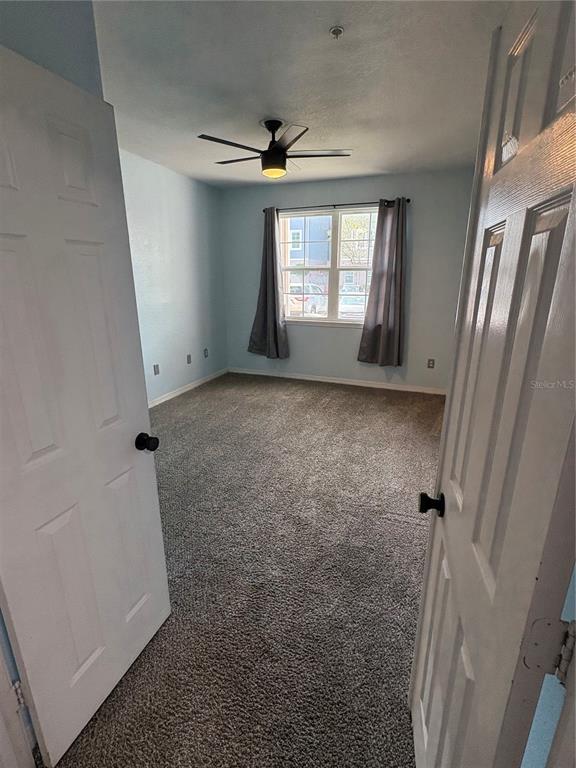 3280 Soho Street, Unit 104 Orlando, FL 32835 - Photo 19 of 23 a view of a hallway with windows