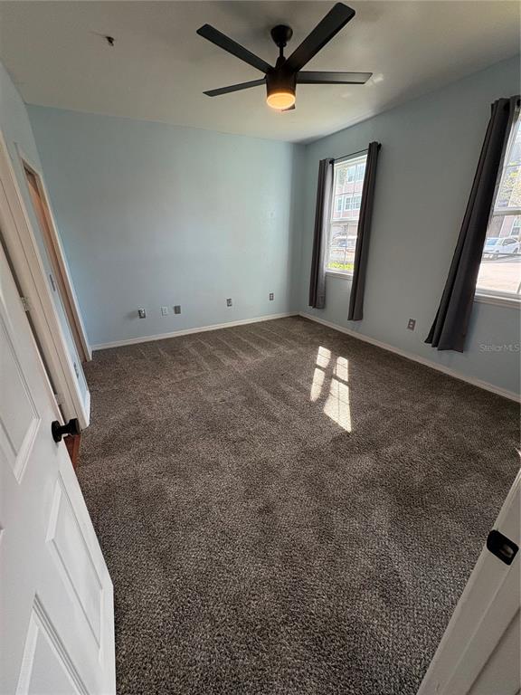 3280 Soho Street, Unit 104 Orlando, FL 32835 - Photo 6 of 23 a view of an empty room and window