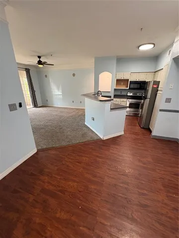 a view of kitchen with sink microwave and stove