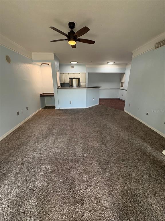 3280 Soho Street, Unit 104 Orlando, FL 32835 - Photo 9 of 23 a view of a livingroom with a ceiling fan and window
