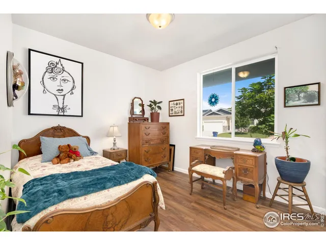 a bedroom with a bed and a table in it