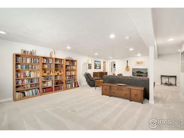 a open kitchen with stainless steel appliances granite countertop a refrigerator and a sink