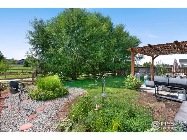 a view of a backyard with sitting area
