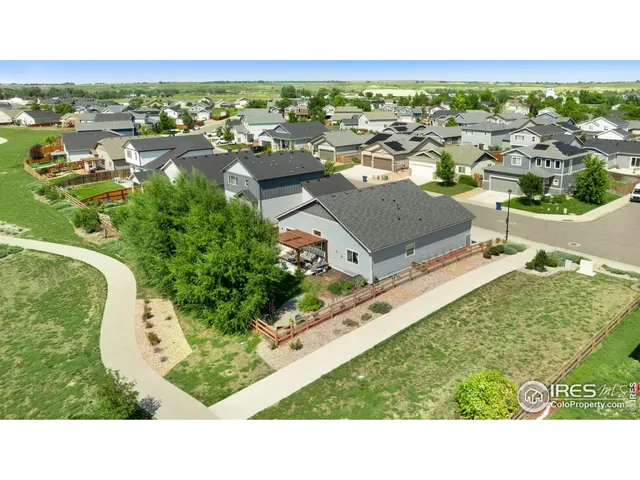 an aerial view of a house with a garden