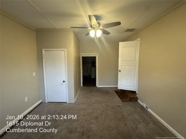 a view of an empty room and window