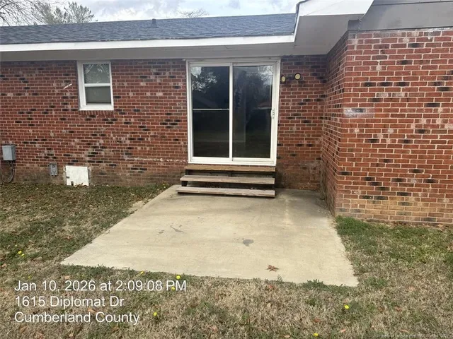 a view of entrance gate of a house