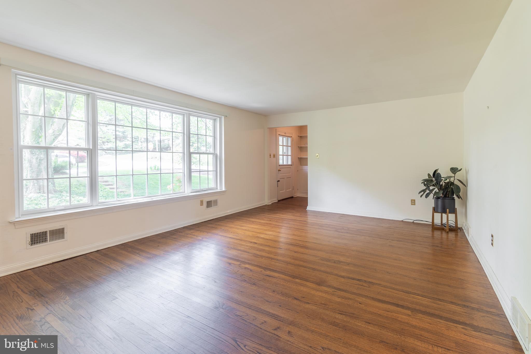 149 Clover Hill Lane Wayne, PA 19087 - Photo 13 of 50 an empty room with wooden floor and windows