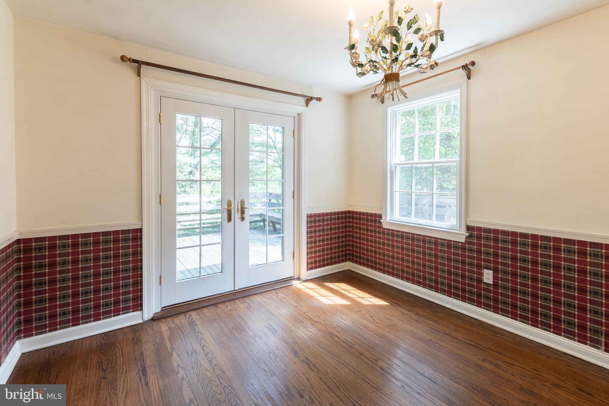 149 Clover Hill Lane Wayne, PA 19087 - Photo 15 of 50 a view of an empty room with wooden floor and a window