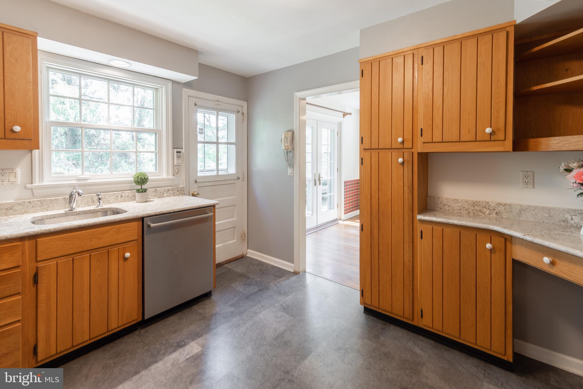 149 Clover Hill Lane Wayne, PA 19087 - Photo 17 of 50 a kitchen with stainless steel appliances granite countertop wooden cabinets a sink and a window