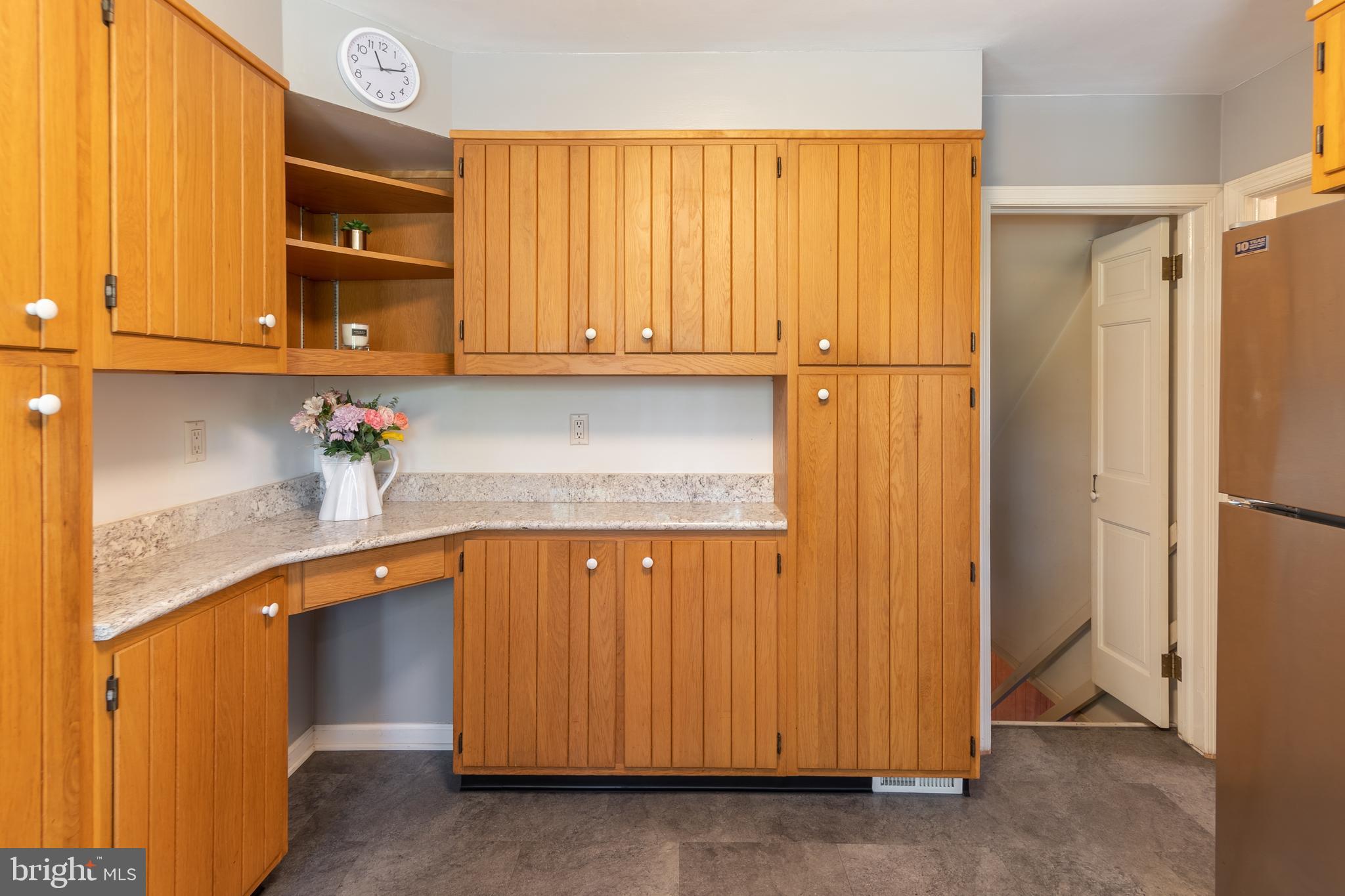 149 Clover Hill Lane Wayne, PA 19087 - Photo 18 of 50 a kitchen with a refrigerator and cabinets