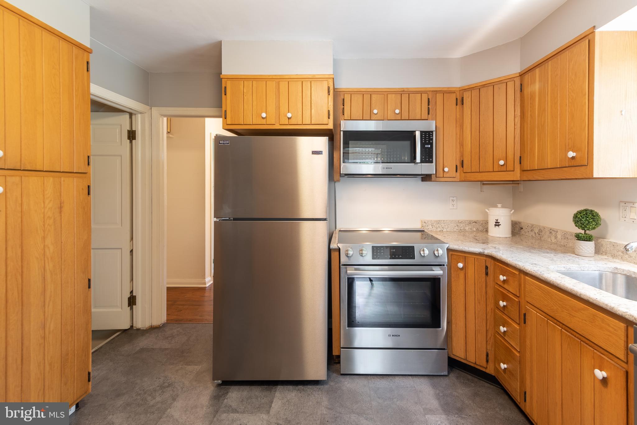 149 Clover Hill Lane Wayne, PA 19087 - Photo 20 of 50 a kitchen with stainless steel appliances granite countertop a refrigerator sink and cabinets