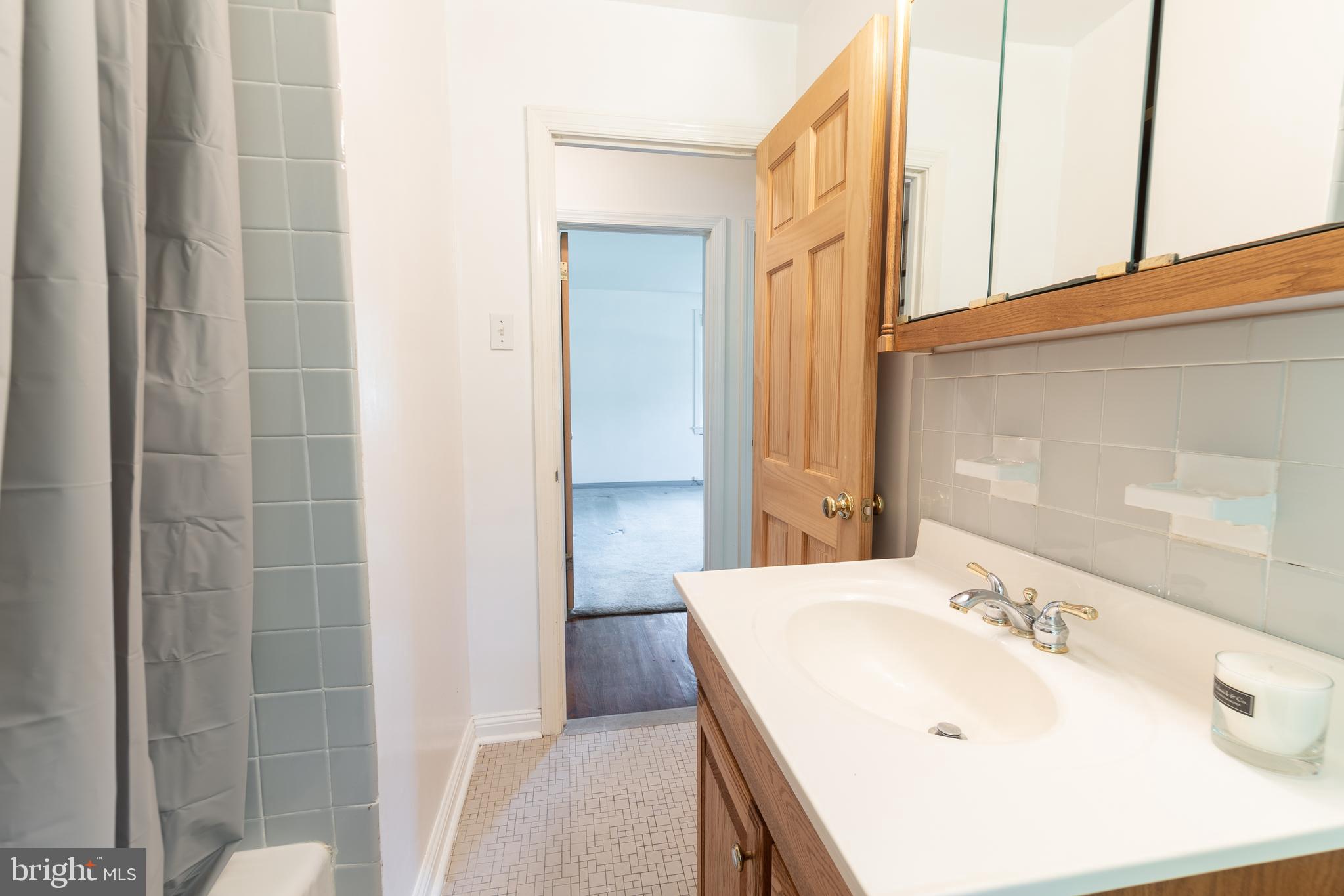 149 Clover Hill Lane Wayne, PA 19087 - Photo 23 of 50 a bathroom with a sink and a mirror