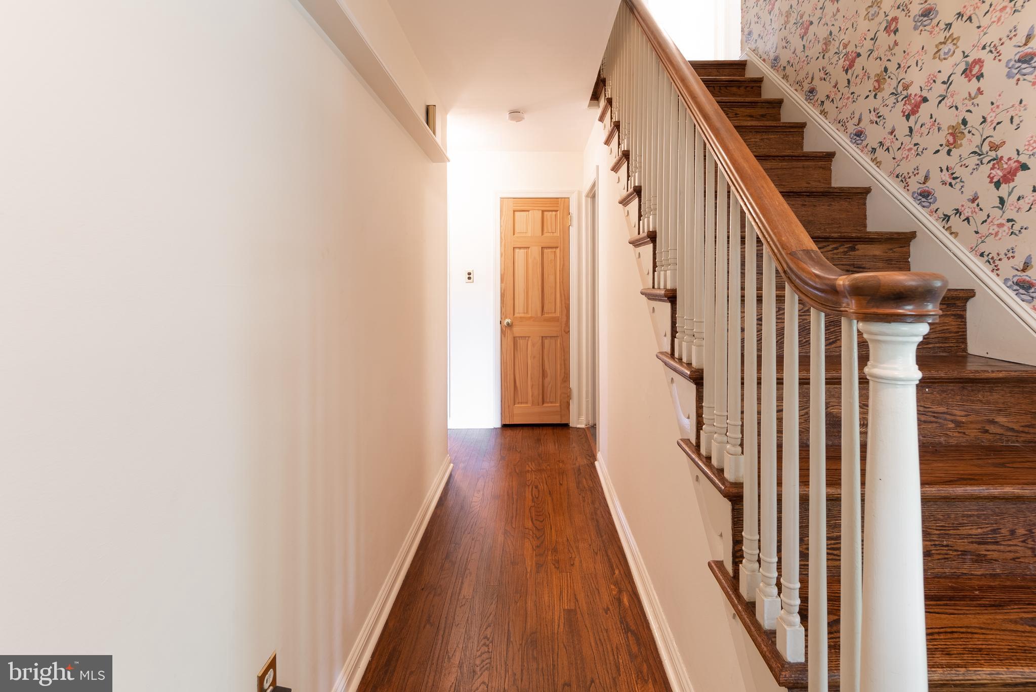 149 Clover Hill Lane Wayne, PA 19087 - Photo 29 of 50 a view of a hallway with wooden floor and staircase