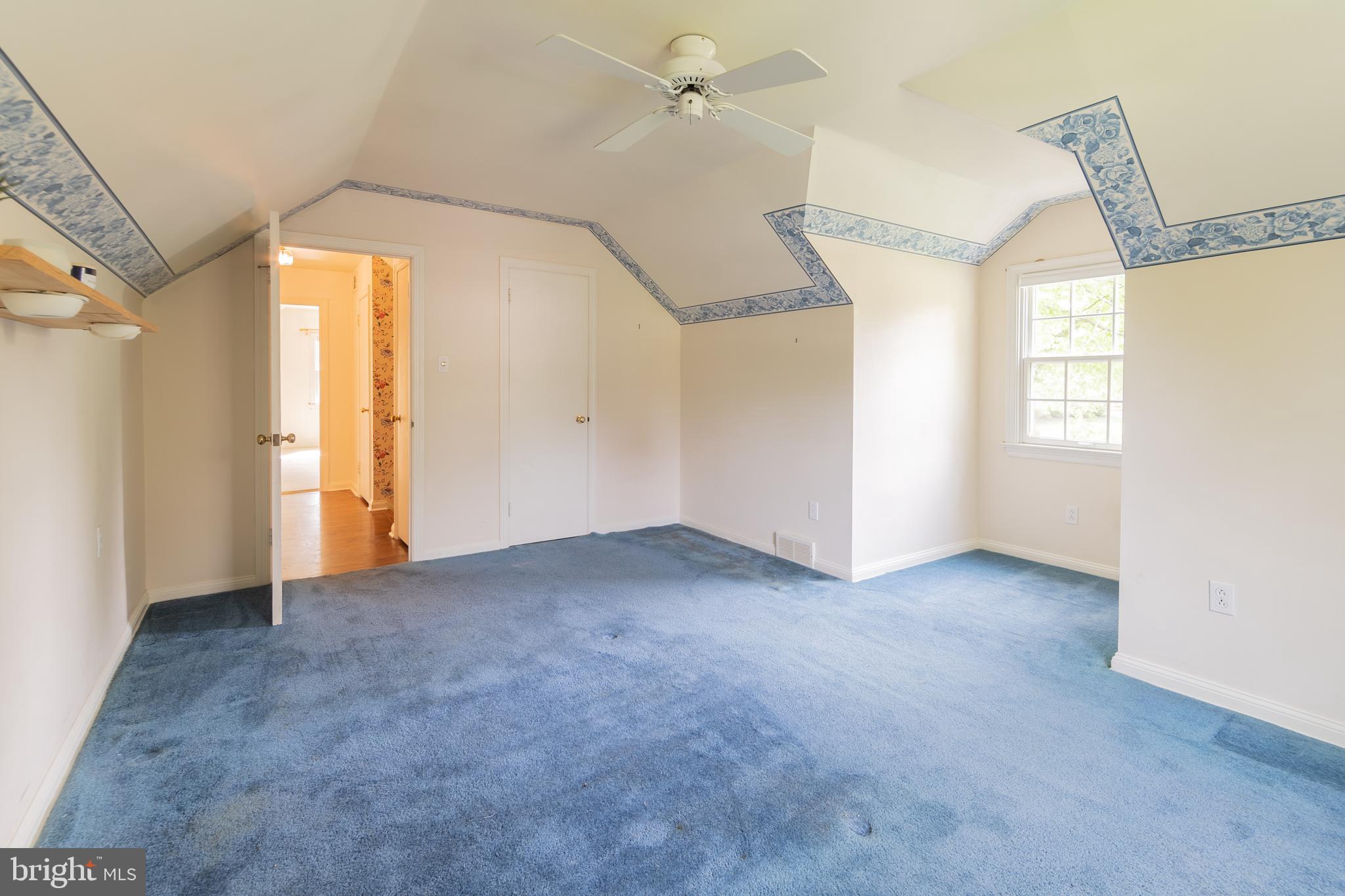 149 Clover Hill Lane Wayne, PA 19087 - Photo 38 of 50 a view of a big room with windows and chandelier fan