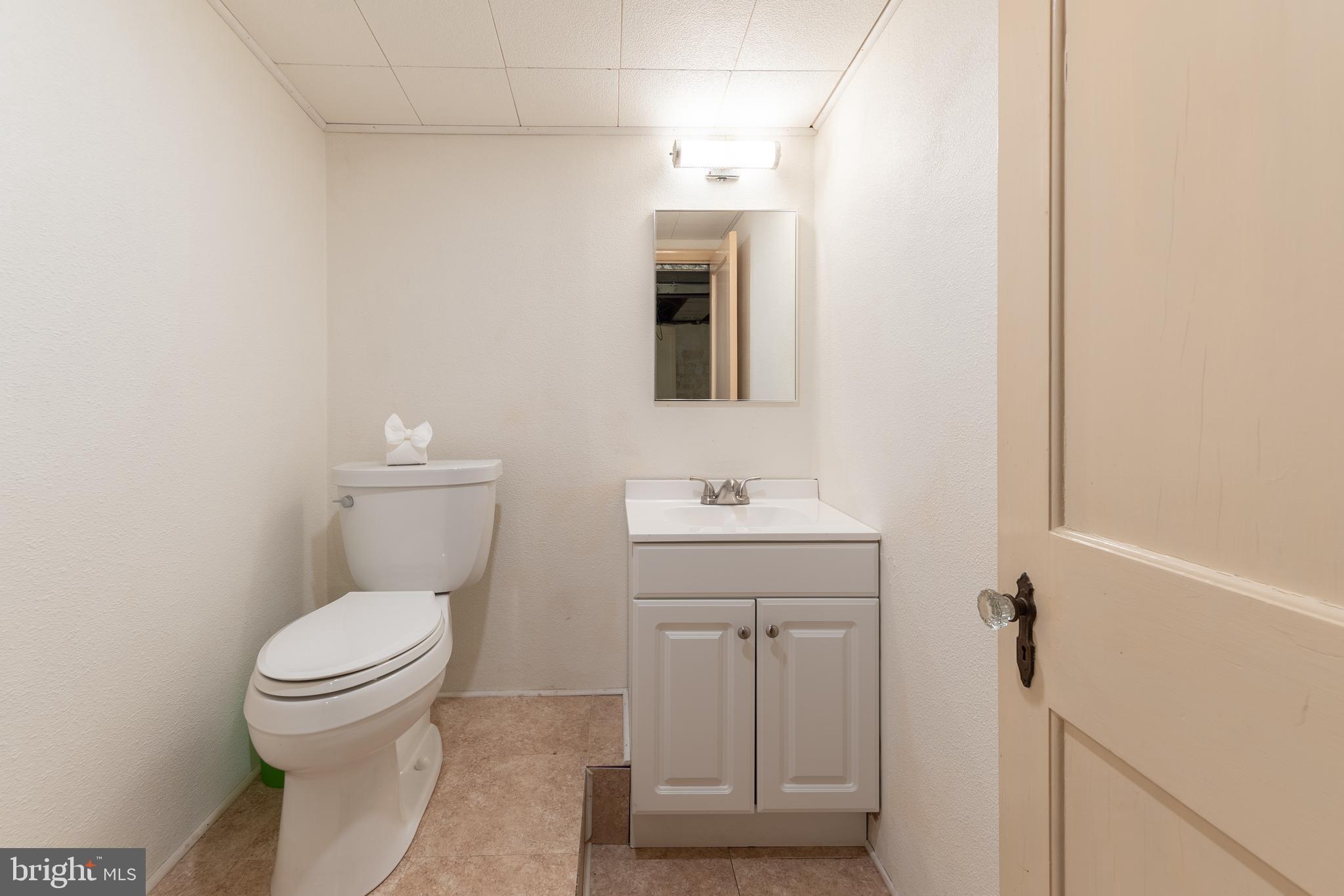149 Clover Hill Lane Wayne, PA 19087 - Photo 43 of 50 a bathroom with a toilet a sink and mirror