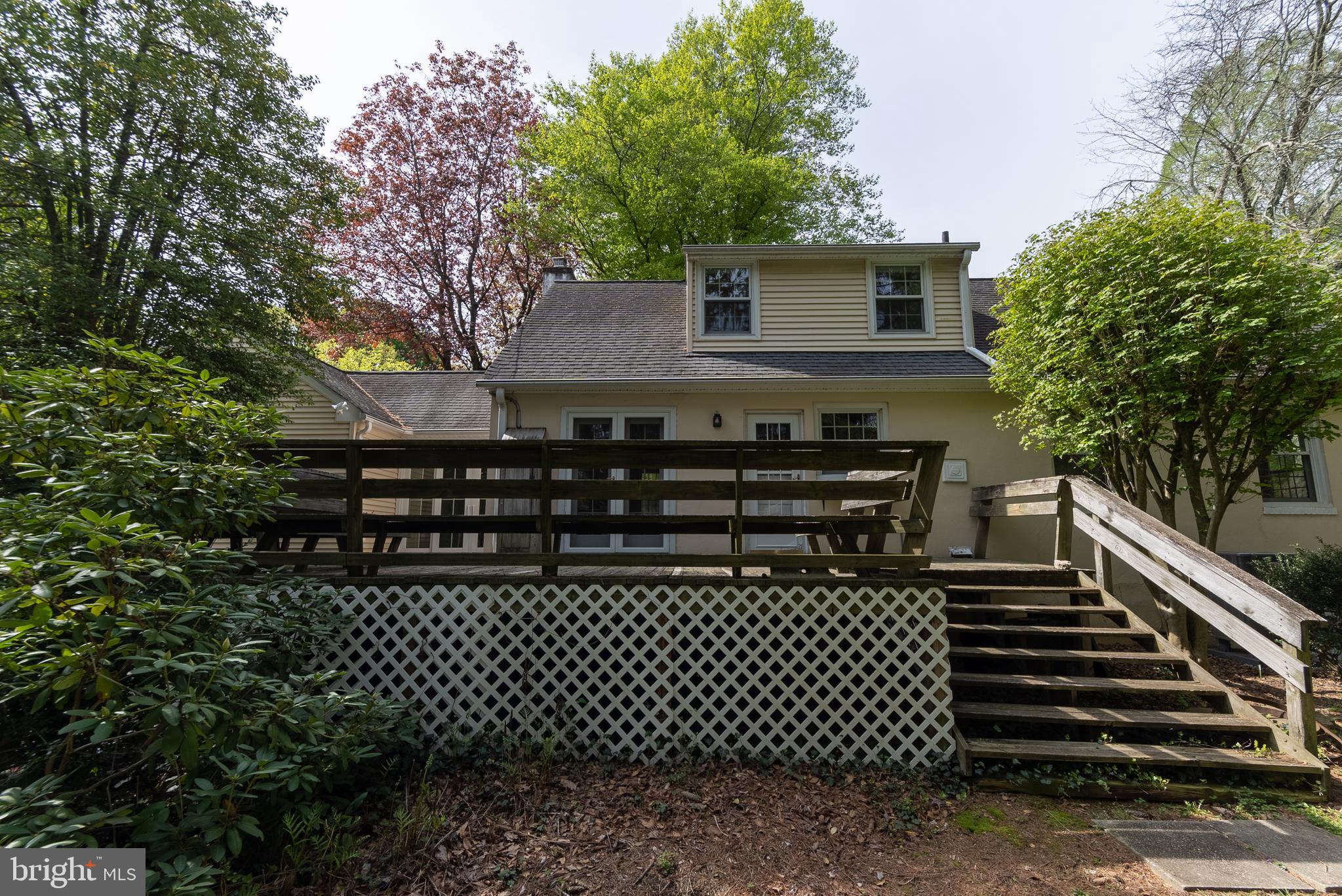 149 Clover Hill Lane Wayne, PA 19087 - Photo 47 of 50 a black and white wall of a building with trees in the background