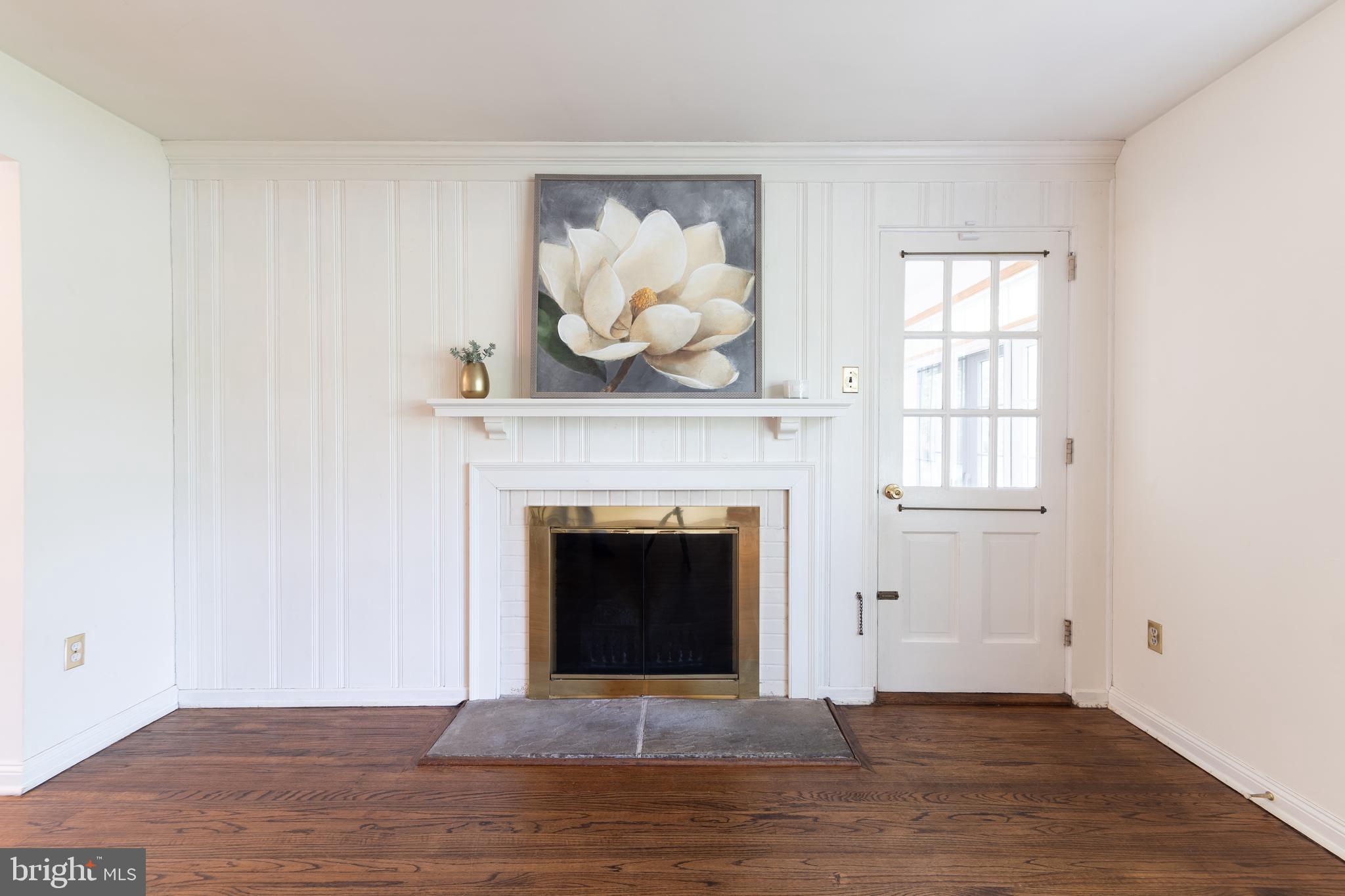 149 Clover Hill Lane Wayne, PA 19087 - Photo 10 of 50 a living room with a fireplace and a window