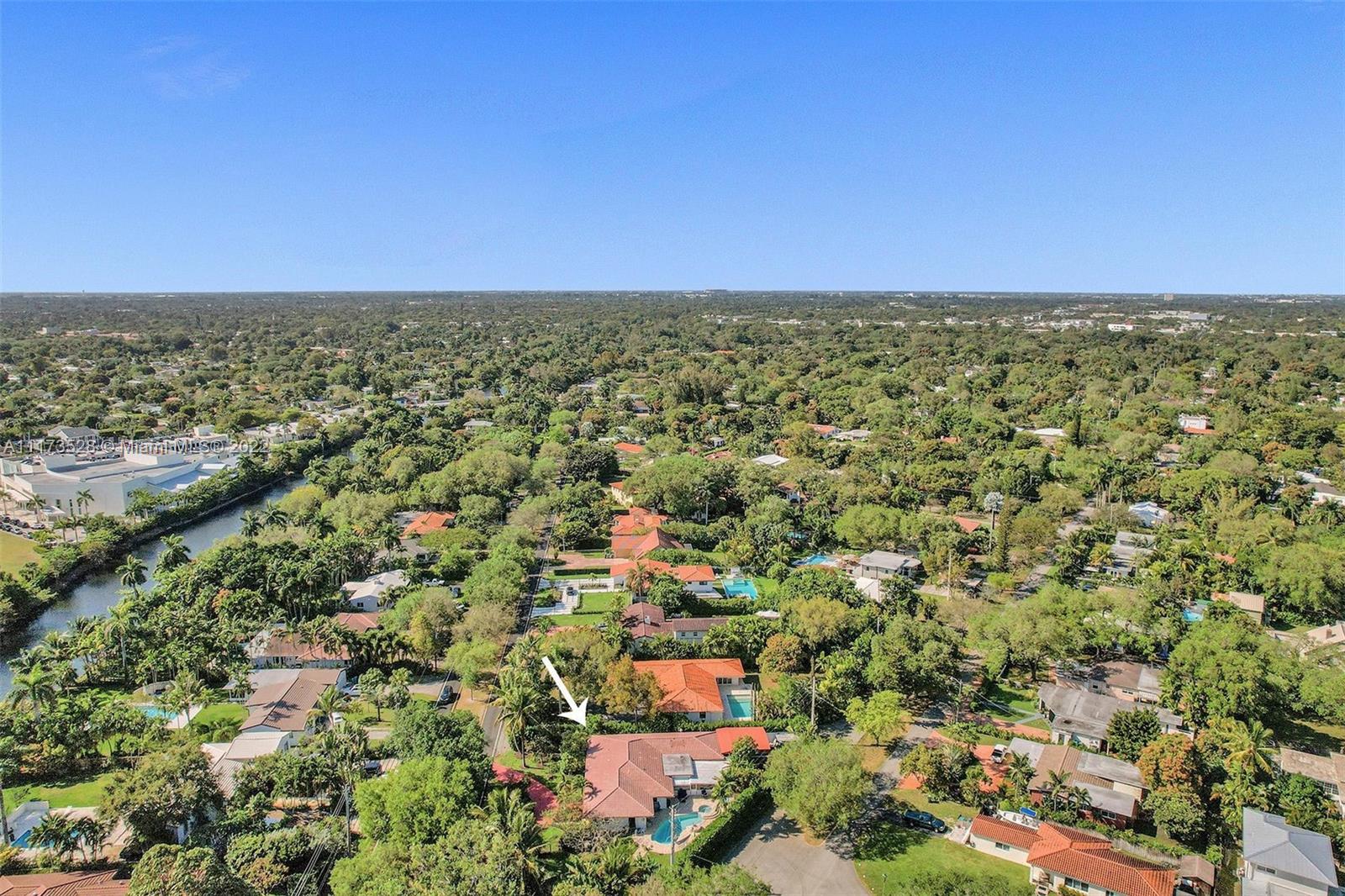 10801 Griffing Boulevard Biscayne Park, FL 33161 - Photo 3 of 77 an aerial view of residential houses with outdoor space and trees