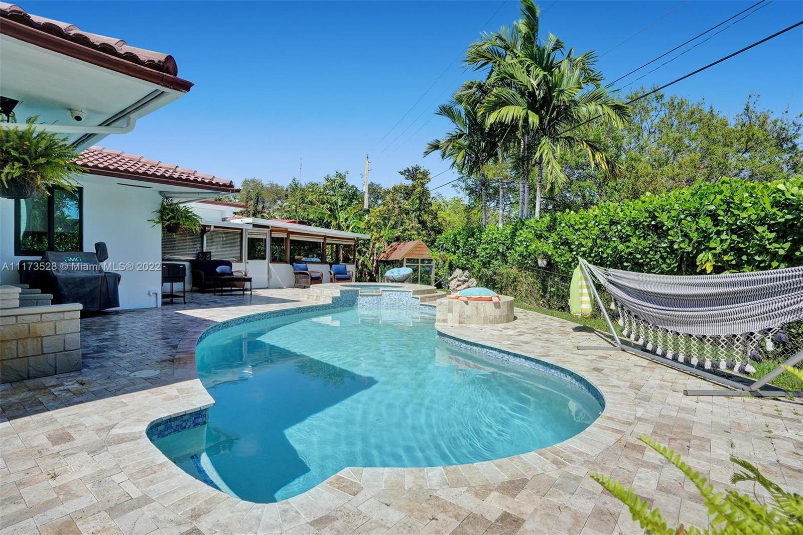 10801 Griffing Boulevard Biscayne Park, FL 33161 - Photo 44 of 77 a view of a swimming pool with a patio