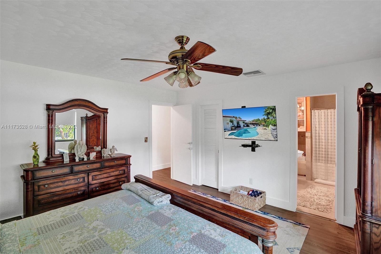 10801 Griffing Boulevard Biscayne Park, FL 33161 - Photo 55 of 77 a living room with furniture and wooden floor