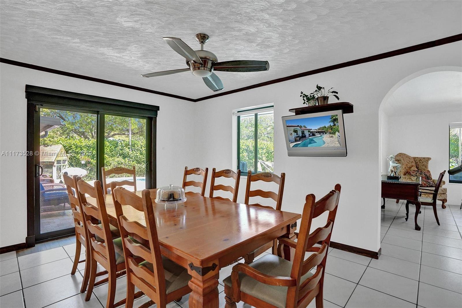 10801 Griffing Boulevard Biscayne Park, FL 33161 - Photo 57 of 77 a view of a dining room with furniture window and outside view