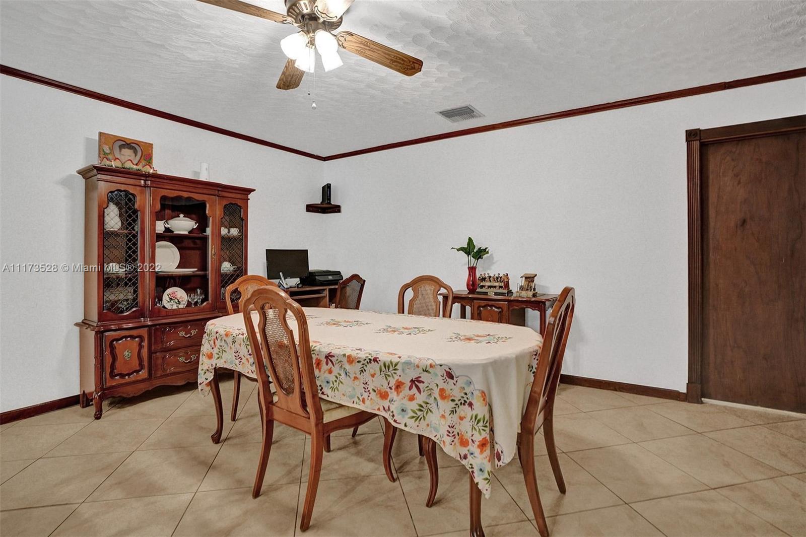 10801 Griffing Boulevard Biscayne Park, FL 33161 - Photo 59 of 77 a view of a dining room with furniture