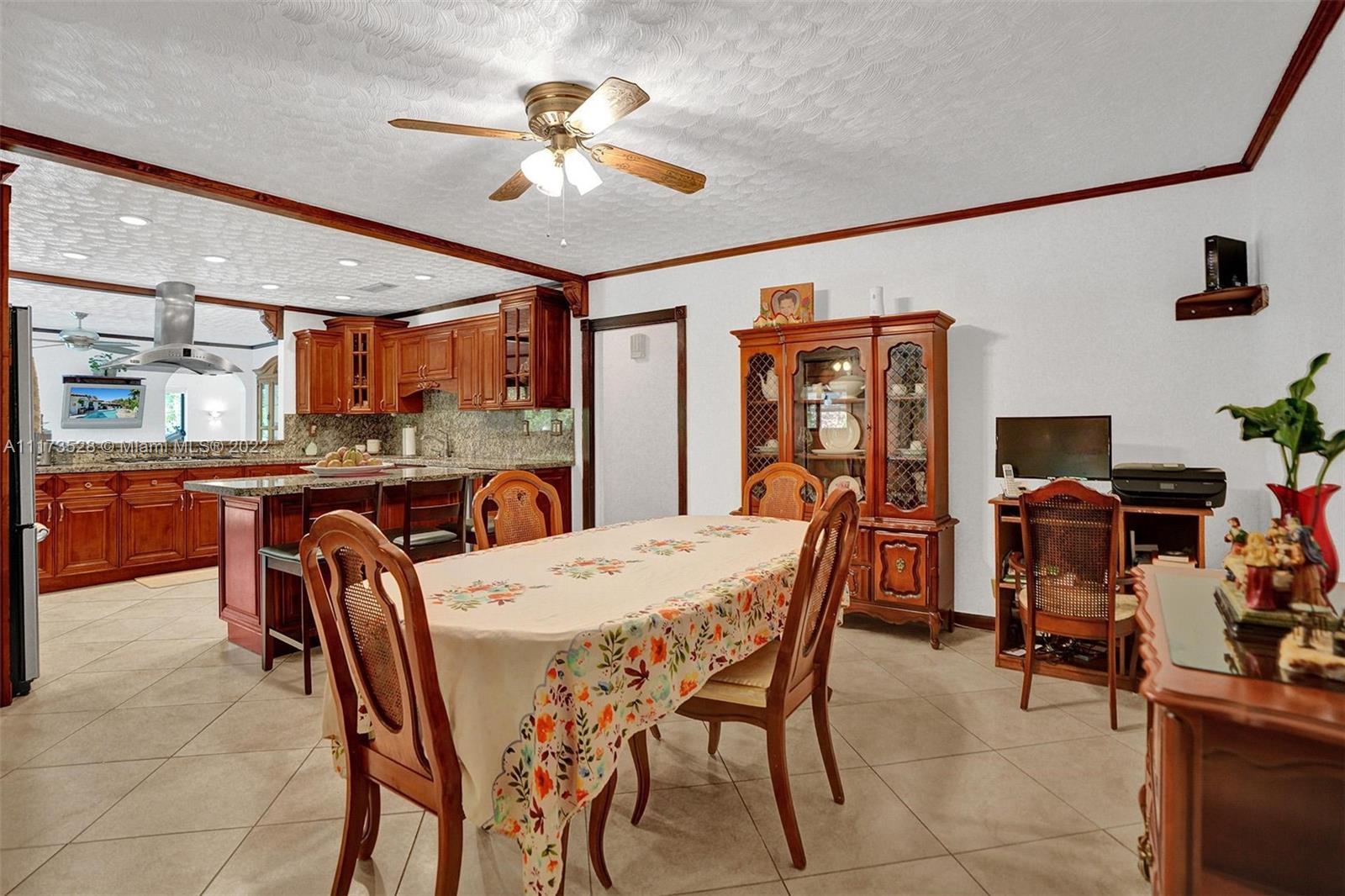 10801 Griffing Boulevard Biscayne Park, FL 33161 - Photo 61 of 77 a dining room with furniture and window
