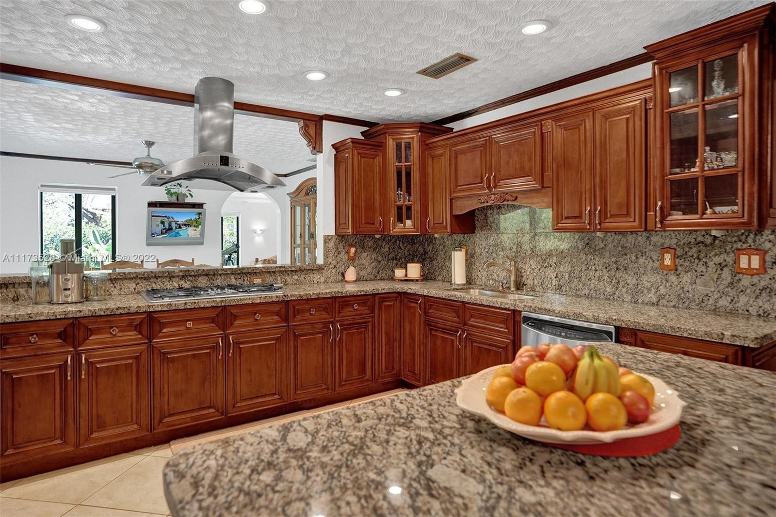 10801 Griffing Boulevard Biscayne Park, FL 33161 - Photo 62 of 77 a kitchen with a sink cabinets and window