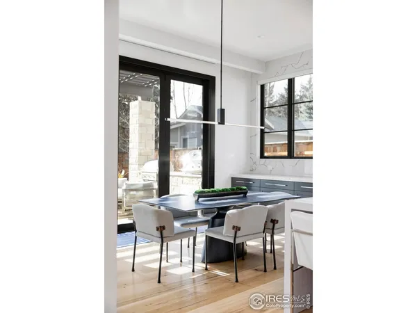 a view of a dining room with furniture and window