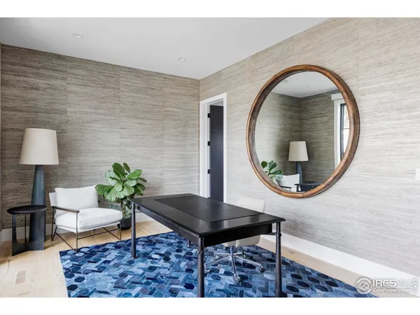 a living room with a table and a potted plant