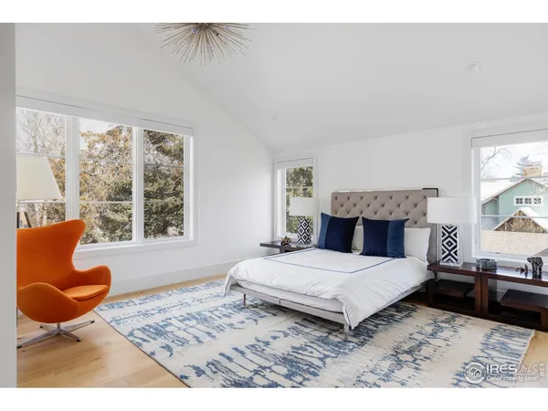 a living room with dining table and a flat screen tv