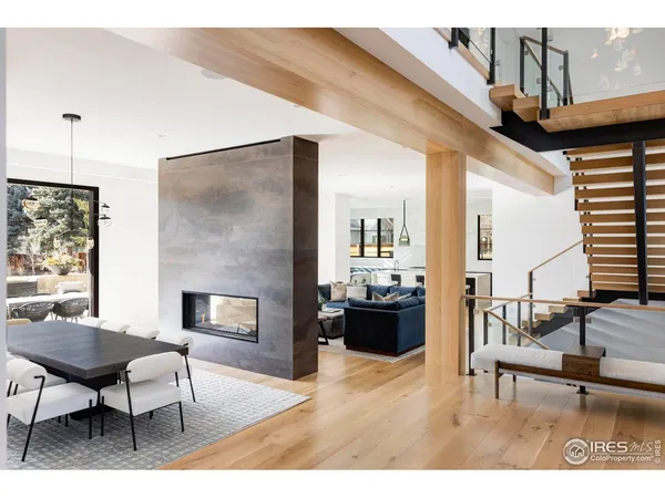 a living room with furniture a fireplace and a table