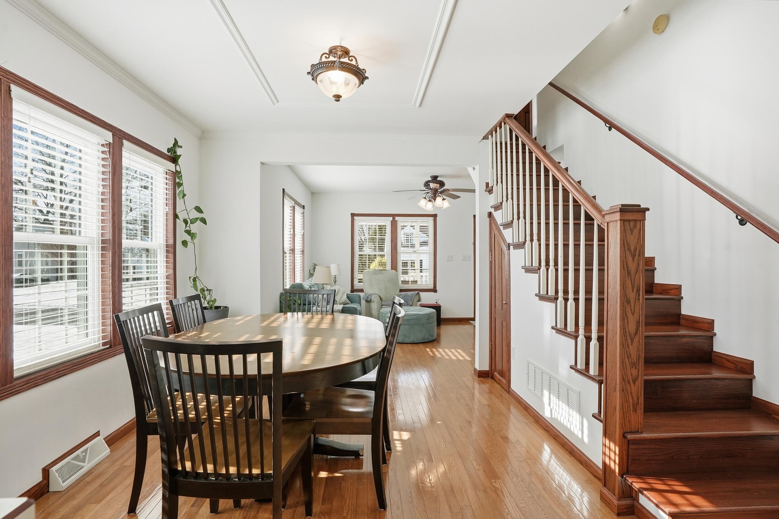 228 Wood Street Crown Point, IN 46307 - Photo 11 of 33 a view of a dining room with furniture window and wooden floor