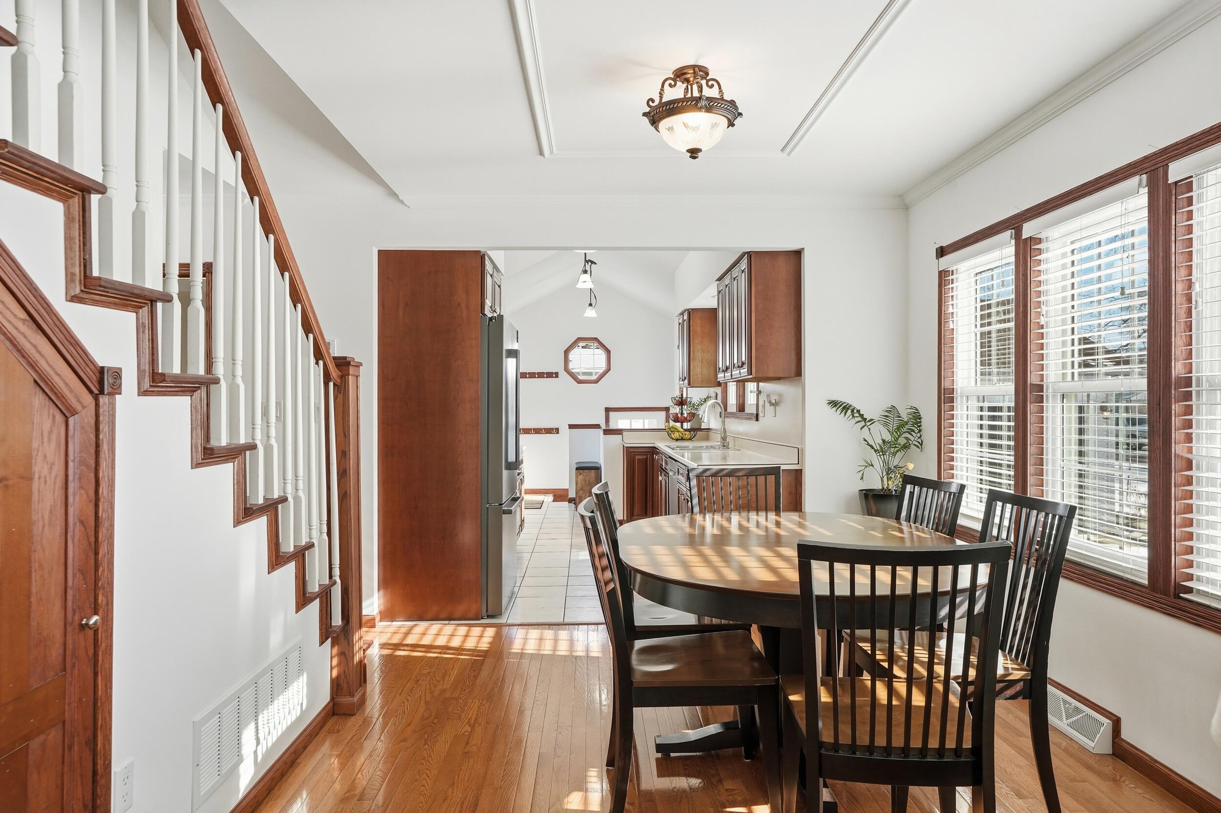 228 Wood Street Crown Point, IN 46307 - Photo 12 of 33 a view of a dining room with furniture window and wooden floor